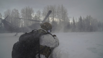 Special Tactics Airmen assigned to 24th Special Operations Wing, Detachment 1, conduct an aerial insertion and field training exercise at Camp Mad Bull training site on Joint Base Elmendorf-Richardson, Alaska, Jan. 10, 2023. The 24 SOW Det 1 Special Tactics Airmen are capable of assessing and opening anything from a major international airport to clandestine dirt strips in either permissive or hostile locations, providing strategic access for follow-on forces during global contingencies, and joint readiness exercises. Alaska Army National Guardsmen assigned to the 207th Aviation Battalion flew UH-60L and HH-60M Black Hawk helicopters in order to support the aerial insertion, medical evacuation and hoist training of the Special Tactics teams. The Alaska Army National Guard’s GSAB routinely trains with all branches of the military as well as civilian agencies to increase its operational interoperability and to be ready for a wide range of federal and state missions.