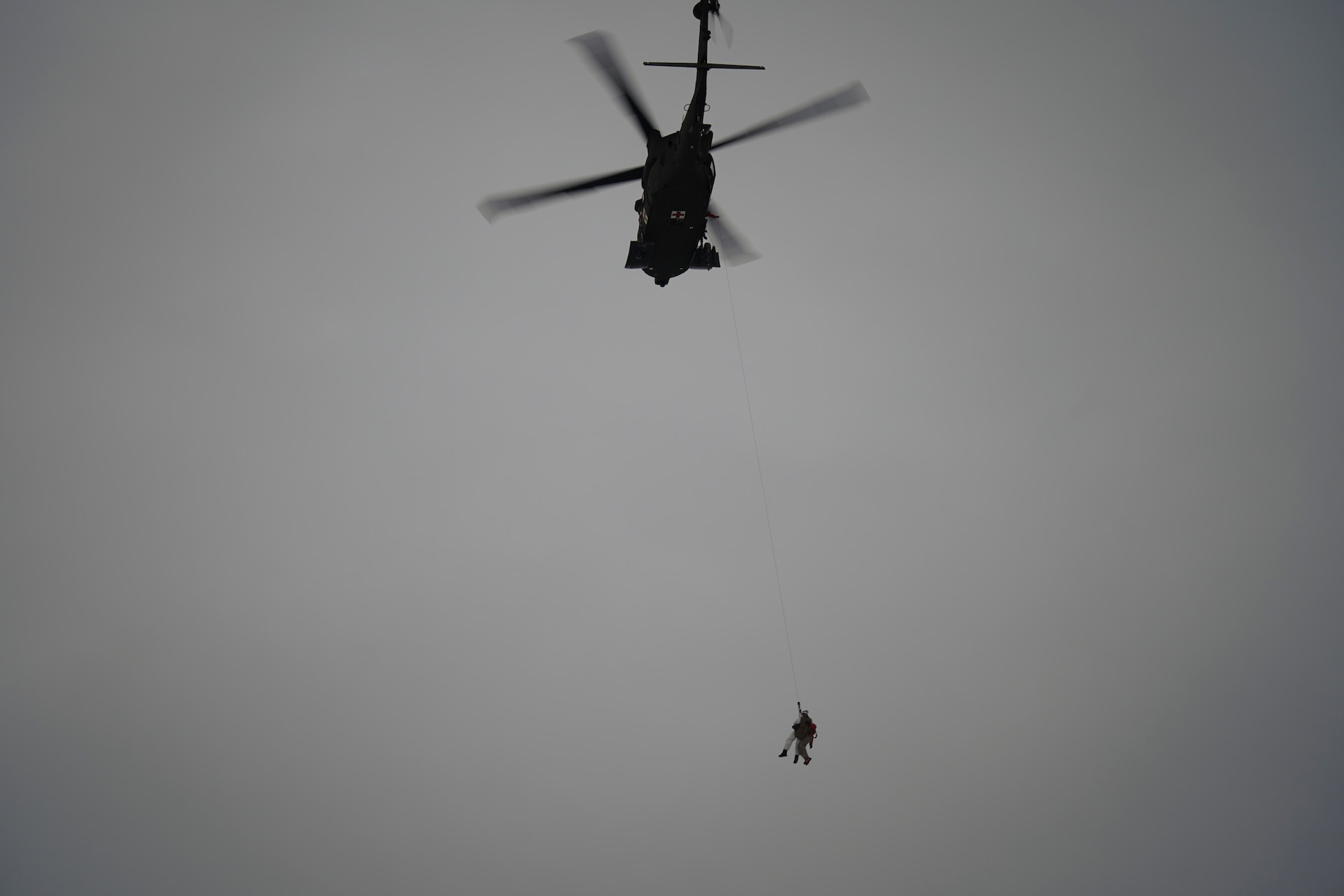 Special Tactics Airmen assigned to 24th Special Operations Wing, Detachment 1, conduct an aerial insertion and field training exercise at Camp Mad Bull training site on Joint Base Elmendorf-Richardson, Alaska, Jan. 10, 2023. The 24 SOW Det 1 Special Tactics Airmen are capable of assessing and opening anything from a major international airport to clandestine dirt strips in either permissive or hostile locations, providing strategic access for follow-on forces during global contingencies, and joint readiness exercises. Alaska Army National Guardsmen assigned to the 207th Aviation Battalion flew UH-60L and HH-60M Black Hawk helicopters in order to support the aerial insertion, medical evacuation and hoist training of the Special Tactics teams. The Alaska Army National Guard’s GSAB routinely trains with all branches of the military as well as civilian agencies to increase its operational interoperability and to be ready for a wide range of federal and state missions.