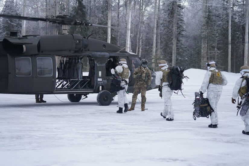 Special Tactics Airmen assigned to 24th Special Operations Wing, Detachment 1, conduct an aerial insertion and field training exercise at Camp Mad Bull training site on Joint Base Elmendorf-Richardson, Alaska, Jan. 10, 2023. The 24 SOW Det 1 Special Tactics Airmen are capable of assessing and opening anything from a major international airport to clandestine dirt strips in either permissive or hostile locations, providing strategic access for follow-on forces during global contingencies, and joint readiness exercises. Alaska Army National Guardsmen assigned to the 207th Aviation Battalion flew UH-60L and HH-60M Black Hawk helicopters in order to support the aerial insertion, medical evacuation and hoist training of the Special Tactics teams. The Alaska Army National Guard’s GSAB routinely trains with all branches of the military as well as civilian agencies to increase its operational interoperability and to be ready for a wide range of federal and state missions.