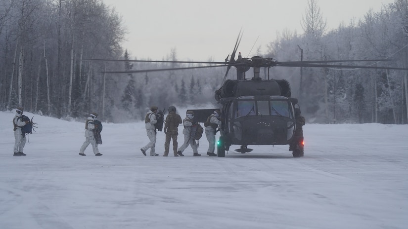 Special Tactics Airmen assigned to 24th Special Operations Wing, Detachment 1, conduct an aerial insertion and field training exercise at Camp Mad Bull training site on Joint Base Elmendorf-Richardson, Alaska, Jan. 10, 2023. The 24 SOW Det 1 Special Tactics Airmen are capable of assessing and opening anything from a major international airport to clandestine dirt strips in either permissive or hostile locations, providing strategic access for follow-on forces during global contingencies, and joint readiness exercises. Alaska Army National Guardsmen assigned to the 207th Aviation Battalion flew UH-60L and HH-60M Black Hawk helicopters in order to support the aerial insertion, medical evacuation and hoist training of the Special Tactics teams. The Alaska Army National Guard’s GSAB routinely trains with all branches of the military as well as civilian agencies to increase its operational interoperability and to be ready for a wide range of federal and state missions.