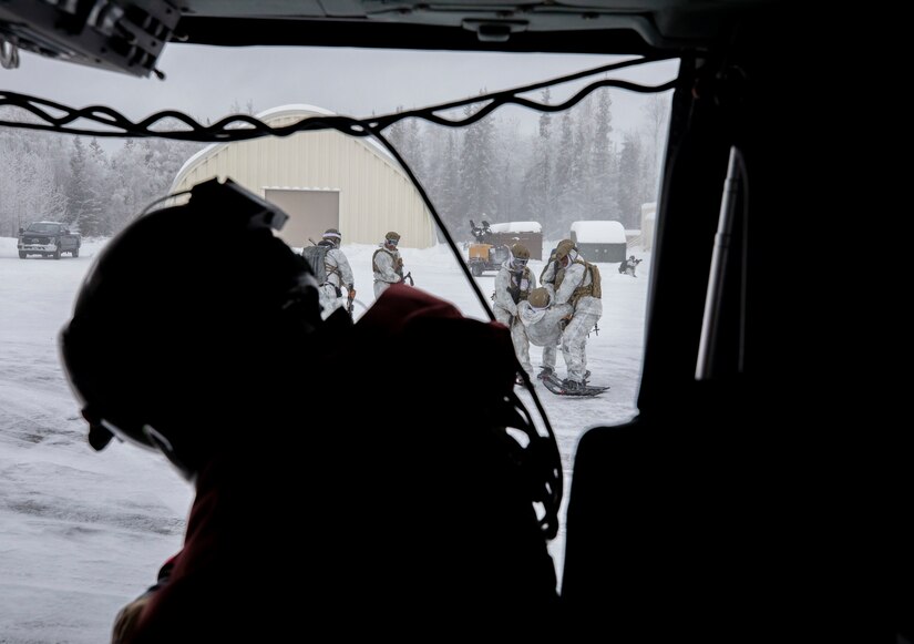 Special Tactics Airmen assigned to 24th Special Operations Wing, Detachment 1, conduct an aerial insertion and field training exercise at Camp Mad Bull training site on Joint Base Elmendorf-Richardson, Alaska, Jan. 10, 2023. The 24 SOW Det 1 Special Tactics Airmen are capable of assessing and opening anything from a major international airport to clandestine dirt strips in either permissive or hostile locations, providing strategic access for follow-on forces during global contingencies, and joint readiness exercises. Alaska Army National Guardsmen assigned to the 207th Aviation Battalion flew UH-60L and HH-60M Black Hawk helicopters in order to support the aerial insertion, medical evacuation and hoist training of the Special Tactics teams. The Alaska Army National Guard’s GSAB routinely trains with all branches of the military as well as civilian agencies to increase its operational interoperability and to be ready for a wide range of federal and state missions.