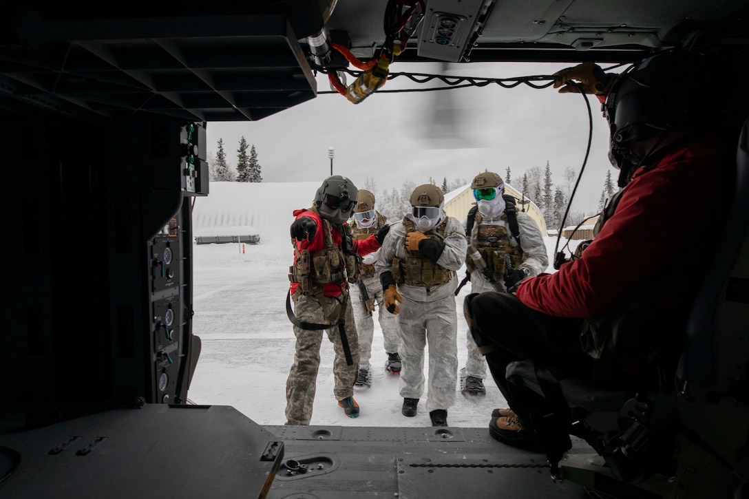 Special Tactics Airmen assigned to 24th Special Operations Wing, Detachment 1, conduct an aerial insertion and field training exercise at Camp Mad Bull training site on Joint Base Elmendorf-Richardson, Alaska, Jan. 10, 2023. The 24 SOW Det 1 Special Tactics Airmen are capable of assessing and opening anything from a major international airport to clandestine dirt strips in either permissive or hostile locations, providing strategic access for follow-on forces during global contingencies, and joint readiness exercises. Alaska Army National Guardsmen assigned to the 207th Aviation Battalion flew UH-60L and HH-60M Black Hawk helicopters in order to support the aerial insertion, medical evacuation and hoist training of the Special Tactics teams. The Alaska Army National Guard’s GSAB routinely trains with all branches of the military as well as civilian agencies to increase its operational interoperability and to be ready for a wide range of federal and state missions.