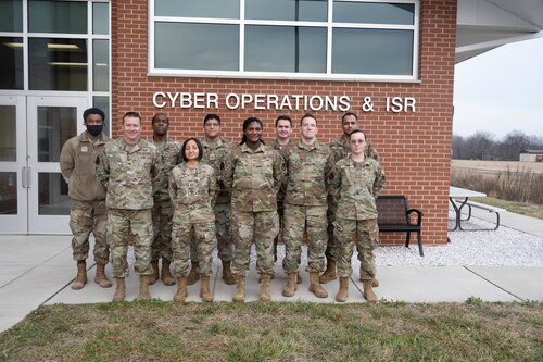 Airmen assigned to the 275th Cyberspace Operations Squadron pose for a photograph at Warfield Air National Guard Base at Martin State Airport, Middle River, Md., Jan. 10, 2023. The cyber protection team that was the first in the Air National Guard to certify on a live Department of Defense network. (U.S. Air National Guard photo by Master Sgt. Chris Schepers)