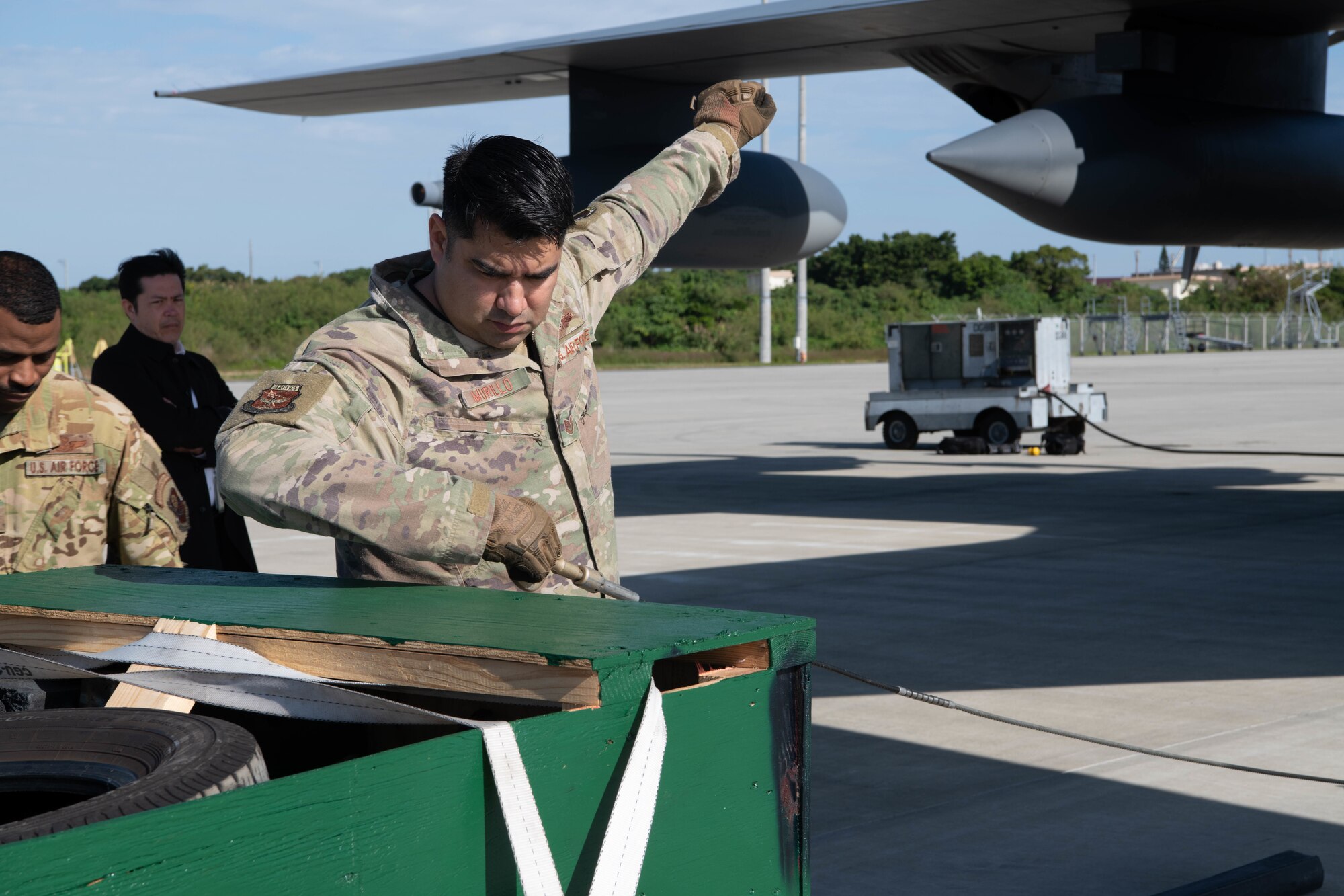 An Airman hand signals a stop.