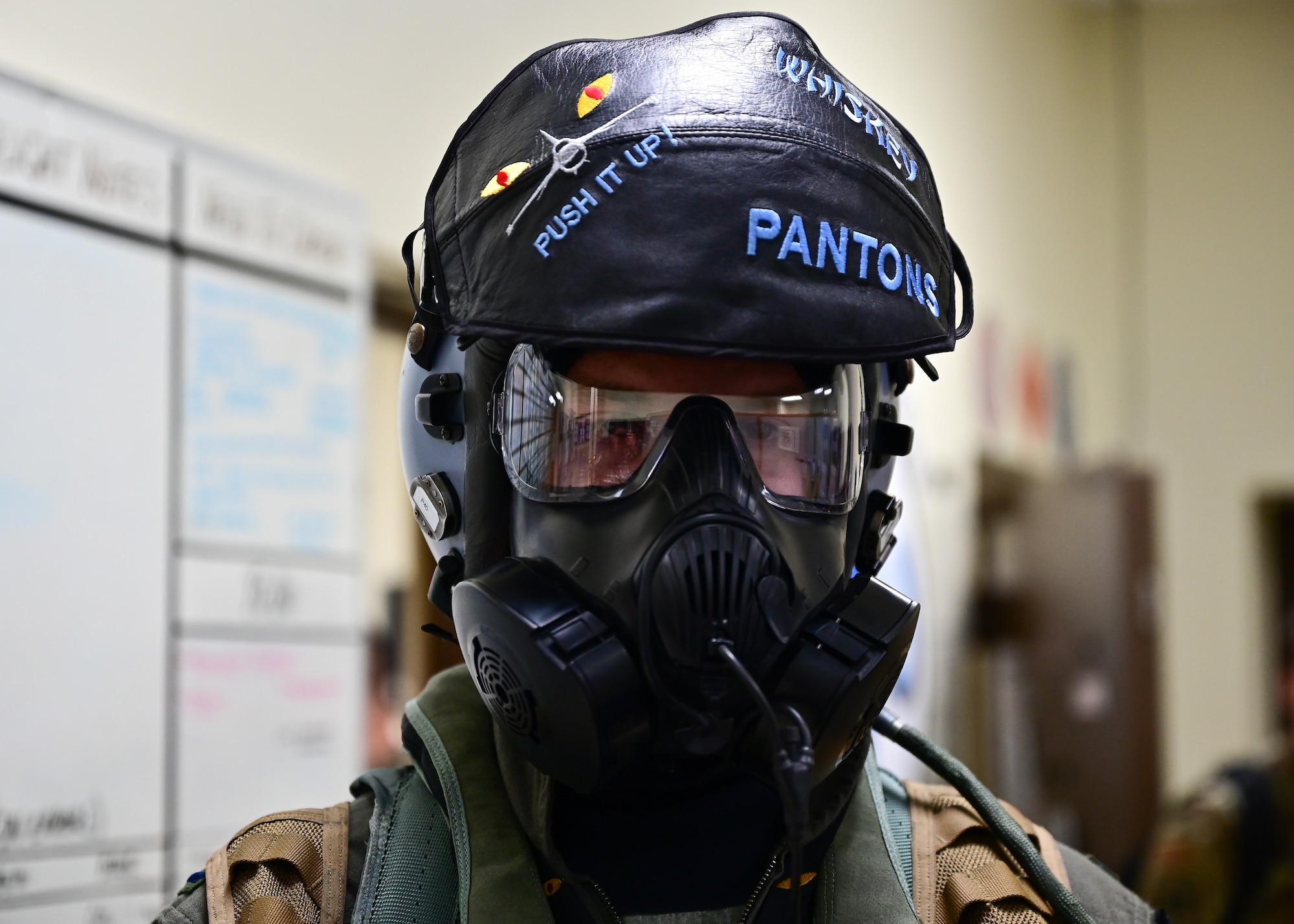 Pilot wears gas mask