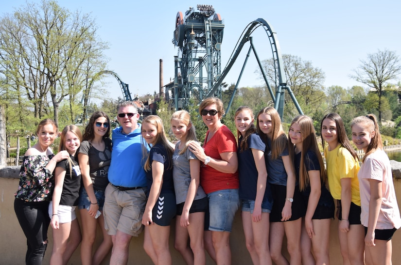 Roger Keesmekers poses for a photo in front of a roller coaster at Efteling Amusement Park in Kaatsheuvel, Netherlands, with one of the handball teams he coached. The Logistics Readiness Center Benelux Brunssum lead transportation specialist said roller coasters are one of his favorite things, followed close by the sport of handball. (Courtesy photo)