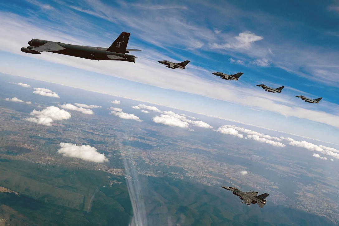 U.S. Air Force 23rd Bomb Squadron B-52H Stratofortress, two German air force Panavia Tornados followed by two German Air Force Eurofighter Typhoons, and one Belgian air force F-16 Fighting Falcon, fly in formation over Germany during Bomber Task Force mission
