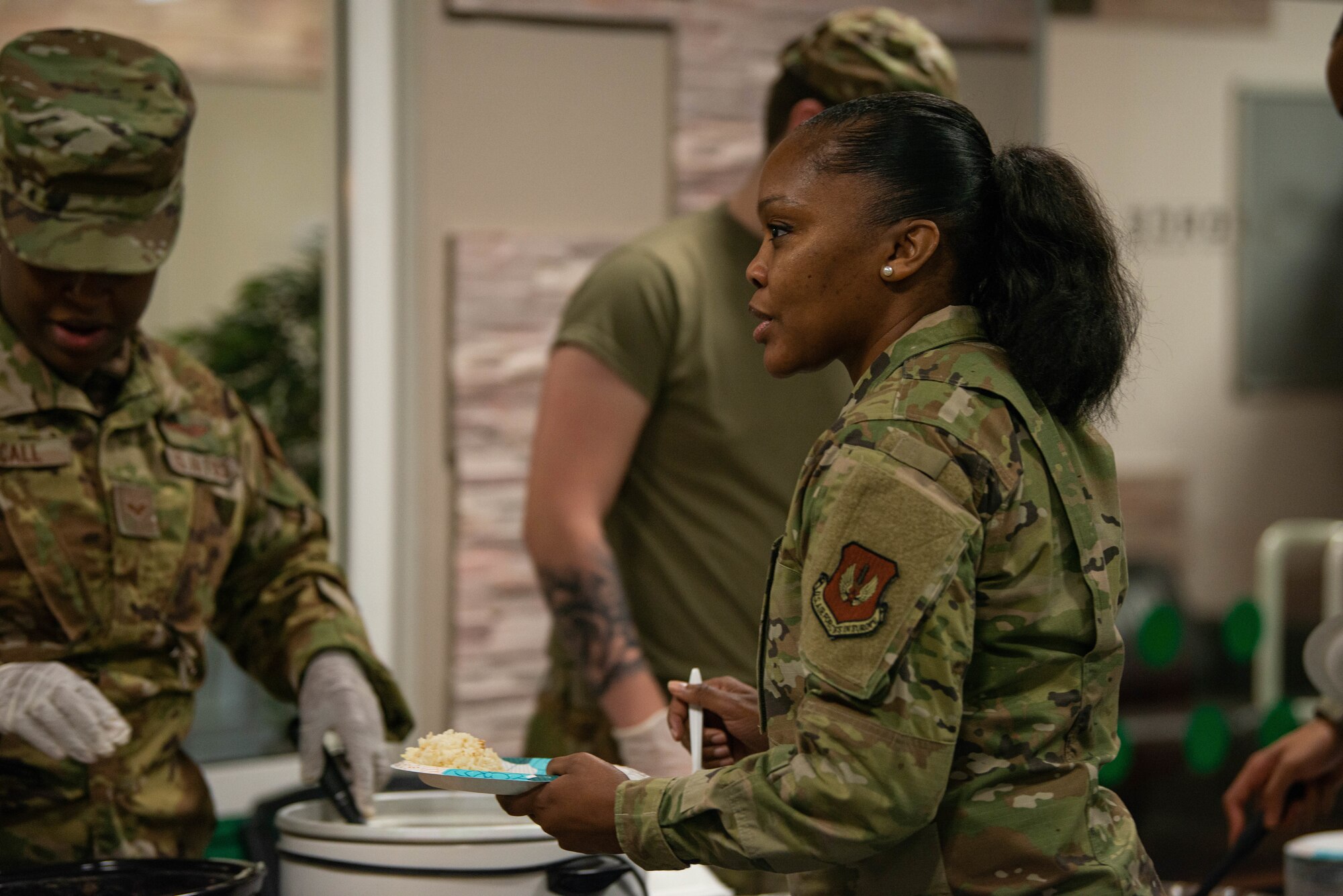 Chief Master Sgt. Kelley gets food at open mic