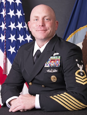 Joshua Mangum reported to Recruit Training Command, Great Lakes, Illinois, in November 1996 and began his career as an Intelligence Specialist.  He completed Intelligence Specialist “A” School and then Imagery Intelligence training at the Navy and Marine Corps Intelligence Training Center that same year.  Follow on orders were to the USS BATAAN (LHD 5) stationed out of Norfolk, Virginia where he served almost four years of sea duty completing the ship’s FOC certification, his Surface Warfare qualification, and the USS BATAAN’s Maiden Voyage in 1999.