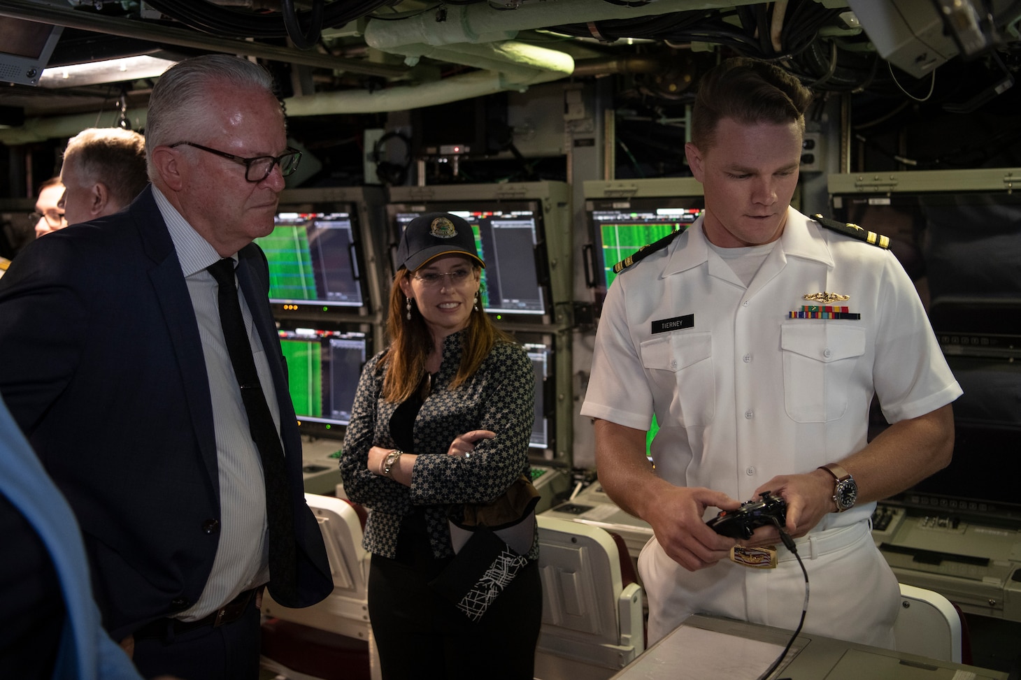 Lt. Bryan Tierney, assigned to the Virginia-class fast-attack submarine USS Mississippi (SSN 782), speaks to distinguished visitors during a tour of the submarine, Nov. 30. Mississippi is visiting HMAS Stirling Naval Base to enhance interoperability, communication, and strengthen relationships with the Royal Australian Navy.