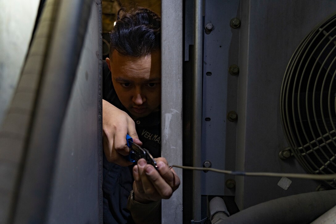 U.S. Air Force Senior Airman Shane Baxter, a maintainer assigned to the 673d Logistics Readiness Squadron, troubleshoots and replaces a connector on a flow sending unit of a 1800 Global Deicer fluid heater system at Joint Base Elmendorf Richardon, Alaska, Oct. 28, 2022.