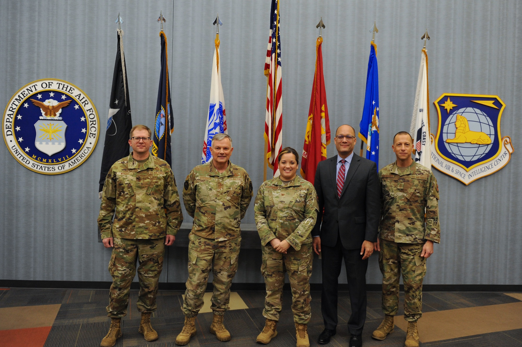 Gen. Glen VanHerck (middle-left), Commander, North American Aerospace Defense Command and U.S. Northern Command, and Maj. Gen. Parker H. Wright, Intelligence and Information director, North American Aerospace Defense Command and United States Northern Command, pose for a photo with National Air and Space Intelligence Center leadership during a visit to Wright-Patterson Air Force Base, Ohio, Jan. 11, 2023. Col. Ariel Batungbacal, NASIC commander, Duane Harrison , NASIC chief scientist, and Chief Master Sgt. Carlos Labrador, NASIC command chief led the visit which highlighted the Intelligence Production Center III, the foreign materiel exploitation  labs, and the Airmen and Guardians who comprise these organizations.