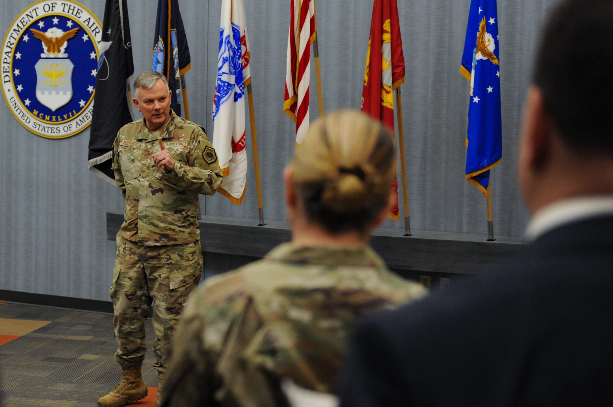 Gen. Glen VanHerck, Commander, North American Aerospace Defense Command and U.S. Northern Command, answers questions from National Air and Space Intelligence Center staff following a coining presentation in the NASIC Forum at Wright-Patterson Air Force Base, Ohio, Jan. 11, 2023. VanHerck coined three individuals from NASIC for their exemplary performance.
