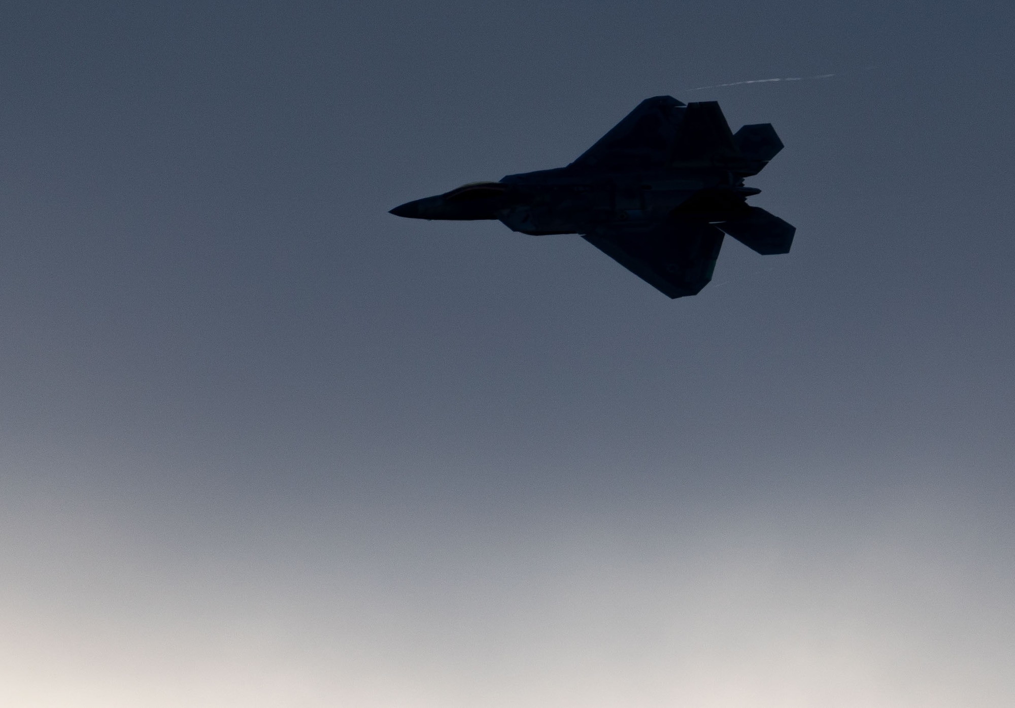 F-22 Raptor Demo team pilot flies during a practice flight