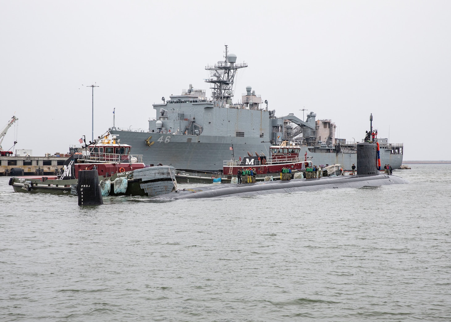 The Virginia-class fast-attack submarine USS New Hampshire (SSN 778) prepares to moor pier side during the boat's homecoming at Naval Station Norfolk, Jan. 17, 2023.