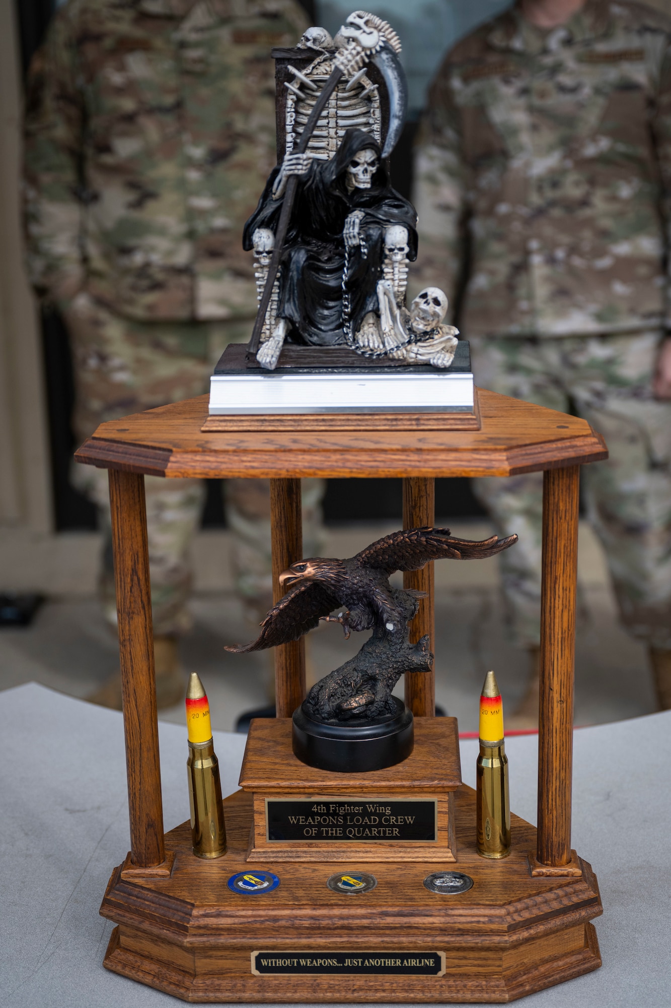 The 4th Fighter Wing Weapons Load Crew of the Quarter trophy sits on a table at Seymour Johnson Air Force Base, North Carolina, Jan. 13, 2023. One crew from four different squadrons were selected to compete in the competition for bragging rights and the trophy.