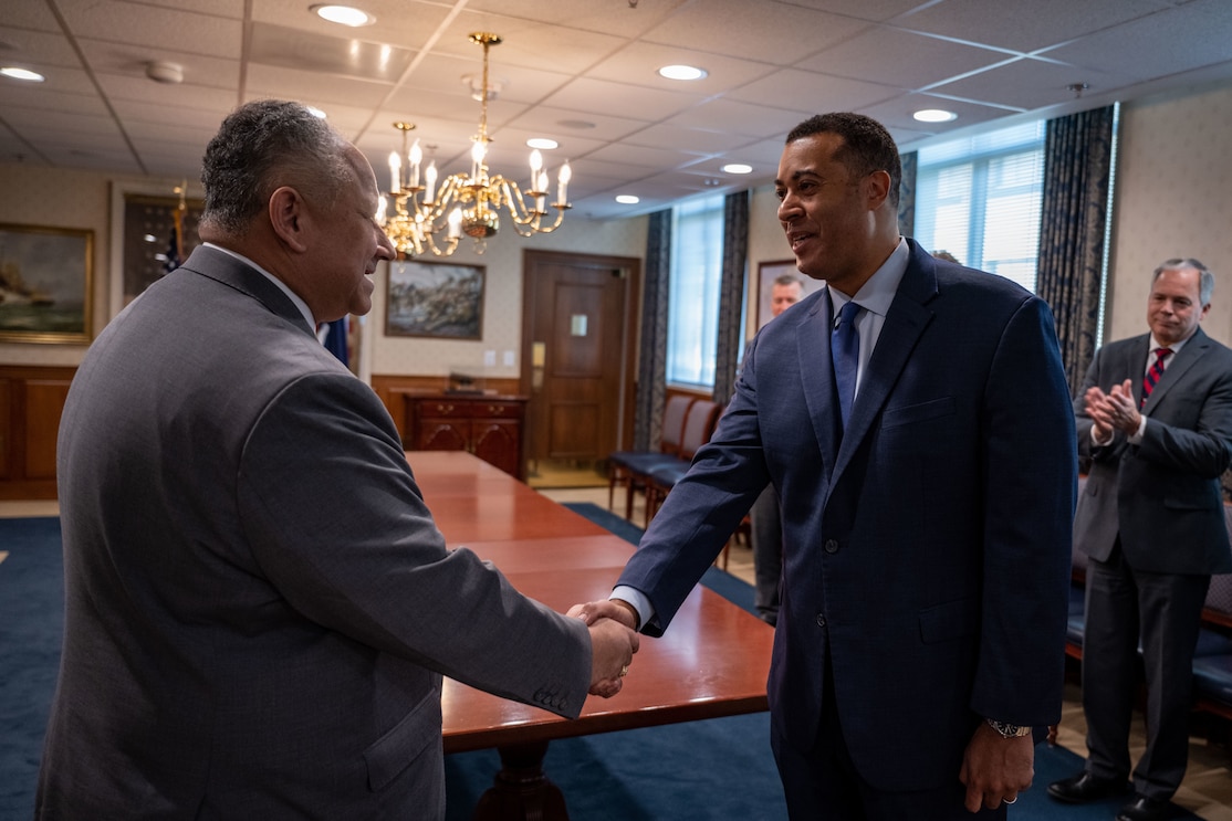 Secretary of the Navy Carlos Del Toro (left) shakes the hand of Franklin Parker after swearing him in as the Assistant Secretary of the Navy for Manpower & Reserve Affairs at the Pentagon, Washington, D.C., Jan. 18, 2023.