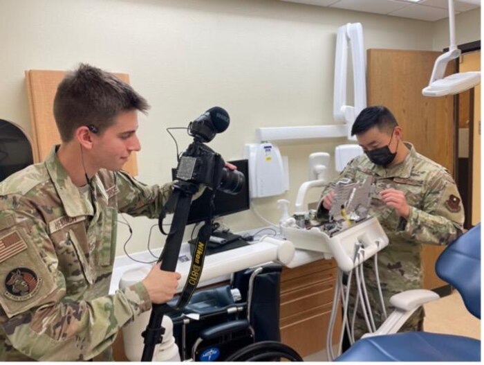 U.S. Air Force Airman 1st Class Zachary Heimbuch recording a medical technician. (Courtesy photo)