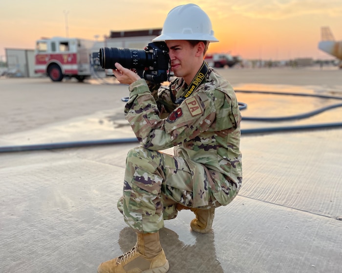 U.S. Air Force Airman 1st Class Zachary Heimbuch, 17th Training Wing public affairs specialist, photographs a training exercise at the Louis F. Garland Department of Defense Fire Academy, Goodfellow Air Force Base, Texas, June 9, 2022. Heimbuch documented the exercise for his on-the-job training and to obtain his 5-level certification. (U.S. Air Force photo by Senior Airman Abbey Rieves)