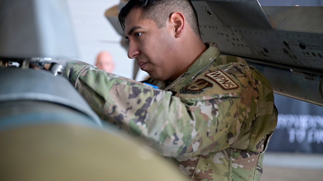 The 411th Raptor AMU, 461st Lightning AMU and 416th Falcon AMU display their superior weapon loading prowess in the 412th MXG Load Crew of the Quarter Competition. These weapons loading juggernauts compete for bragging rights to be named the best of the best here at Edwards Air Force Base.