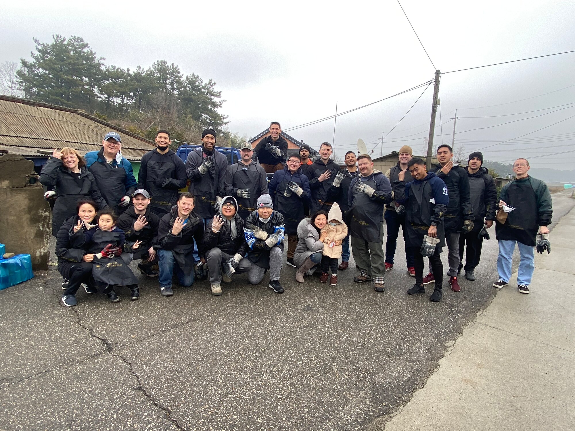 Airmen with the 8th Fighter Wing take a group photo in Gunsan City, Republic of Korea, Jan. 14, 2023. Kunsan Air Base personnel participate in activities to take care of the local community and contribute to bettering local relations. (U.S. Air Force photo by Tech. Sgt. Timothy D. Dischinat)