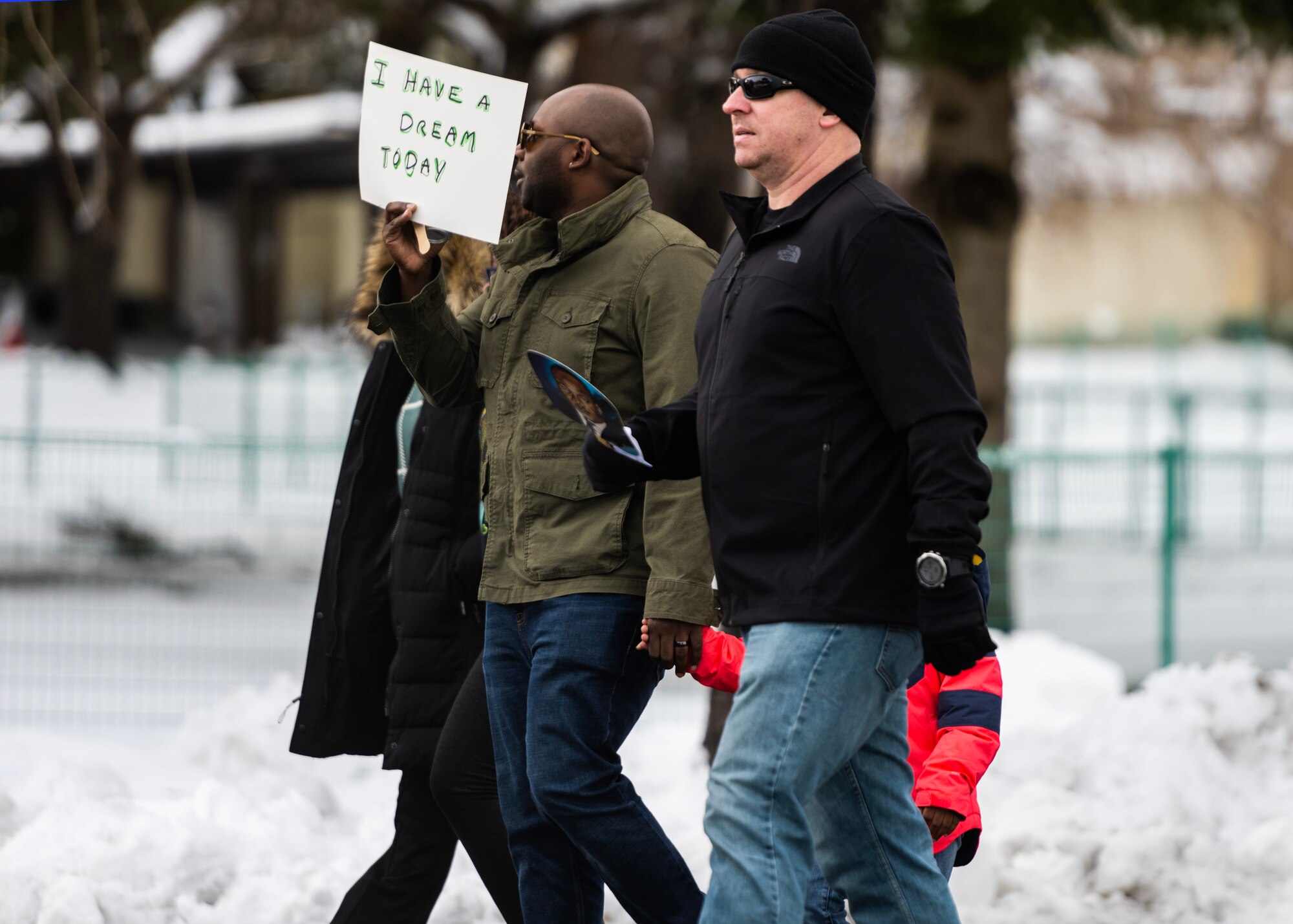 Members of Team Misawa imitate the Selma to Montgomery Mmarch in celebration of Martin Luther King, Jr. Day at Misawa Air Base, Japan, Jan. 16, 2023. Martin Luther King, Jr. Day is a federal holiday in the United States marking the birthday of Martin Luther King, Jr., the chief spokesperson for nonviolent activism in the Civil Rights Movement, which protested racial discrimination in federal and state law.