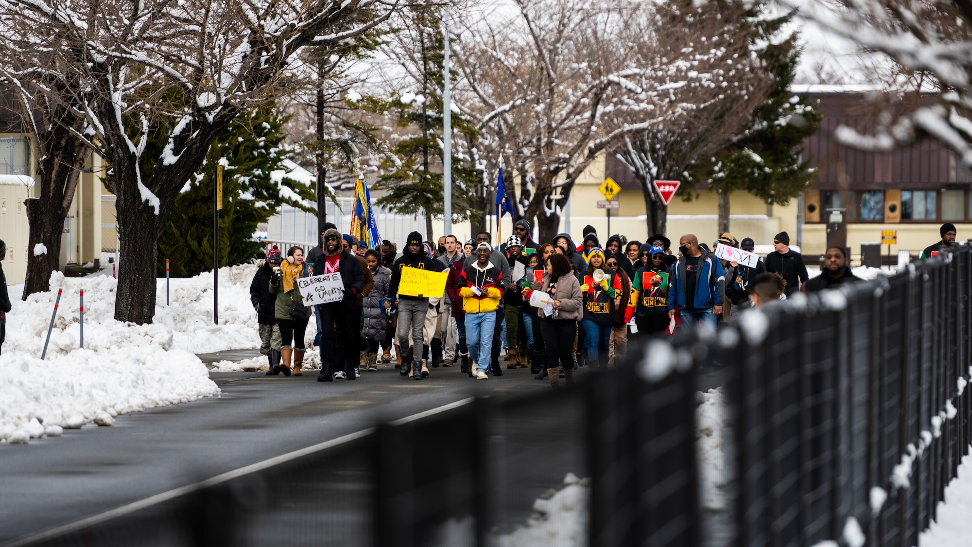 Members of Team Misawa imitate the Selma to Montgomery Mmarch in celebration of Martin Luther King, Jr. Day at Misawa Air Base, Japan, Jan. 16, 2023. Martin Luther King, Jr. Day is a federal holiday in the United States marking the birthday of Martin Luther King, Jr., the chief spokesperson for nonviolent activism in the Civil Rights Movement, which protested racial discrimination in federal and state law.