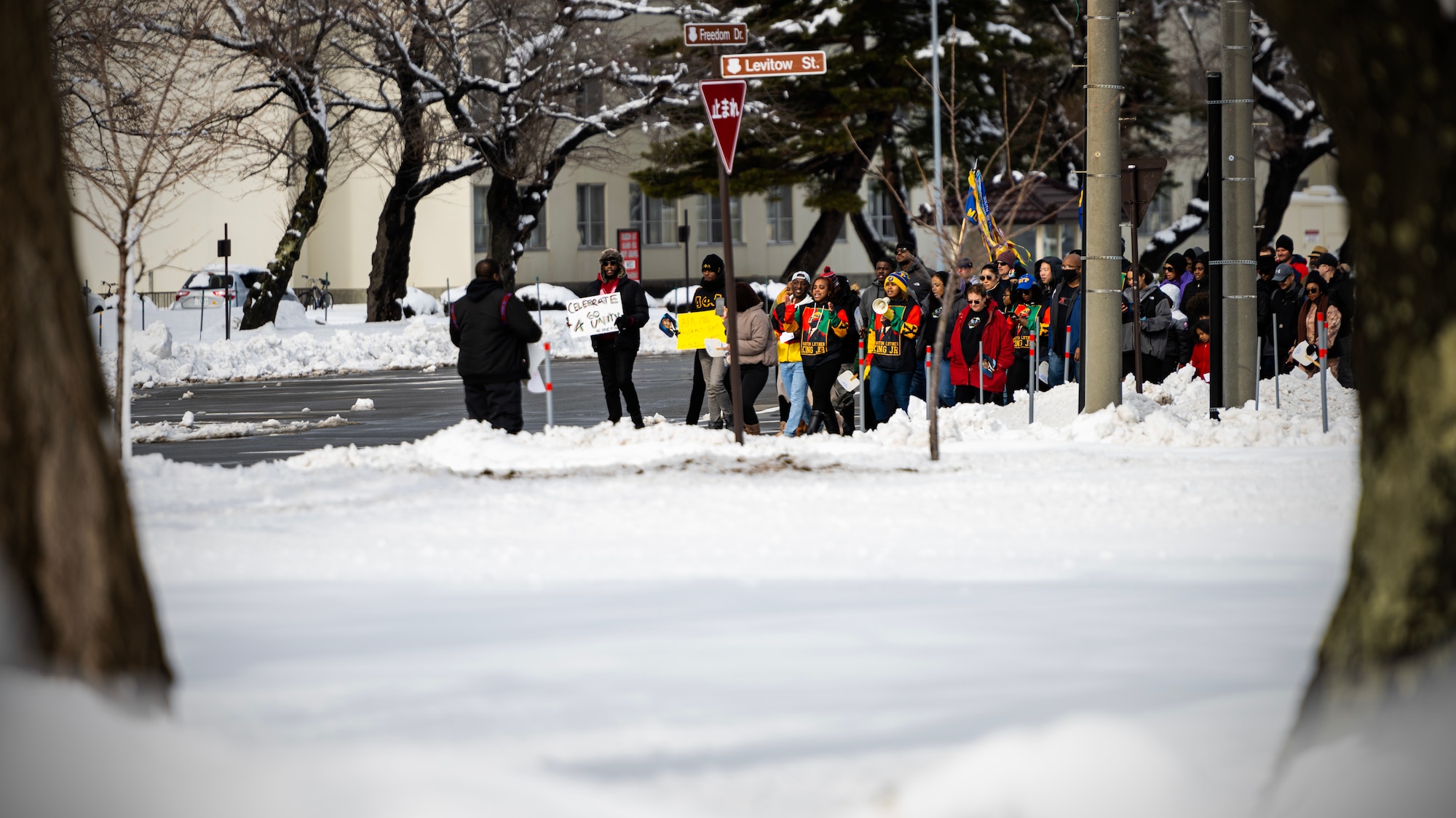 Members of Team Misawa imitate the Selma to Montgomery Mmarch in celebration of Martin Luther King, Jr. Day at Misawa Air Base, Japan, Jan. 16, 2023. Martin Luther King, Jr. Day is a federal holiday in the United States marking the birthday of Martin Luther King, Jr., the chief spokesperson for nonviolent activism in the Civil Rights Movement, which protested racial discrimination in federal and state law.