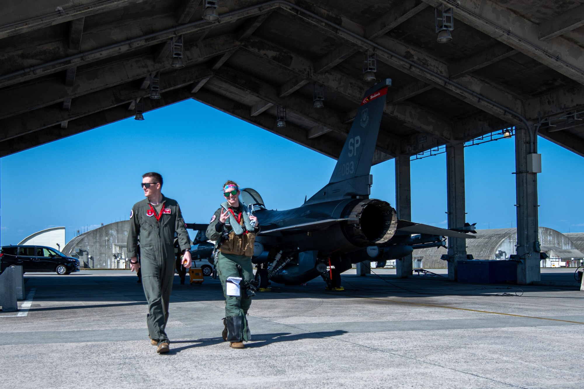 Airmen complete checks on a jet.