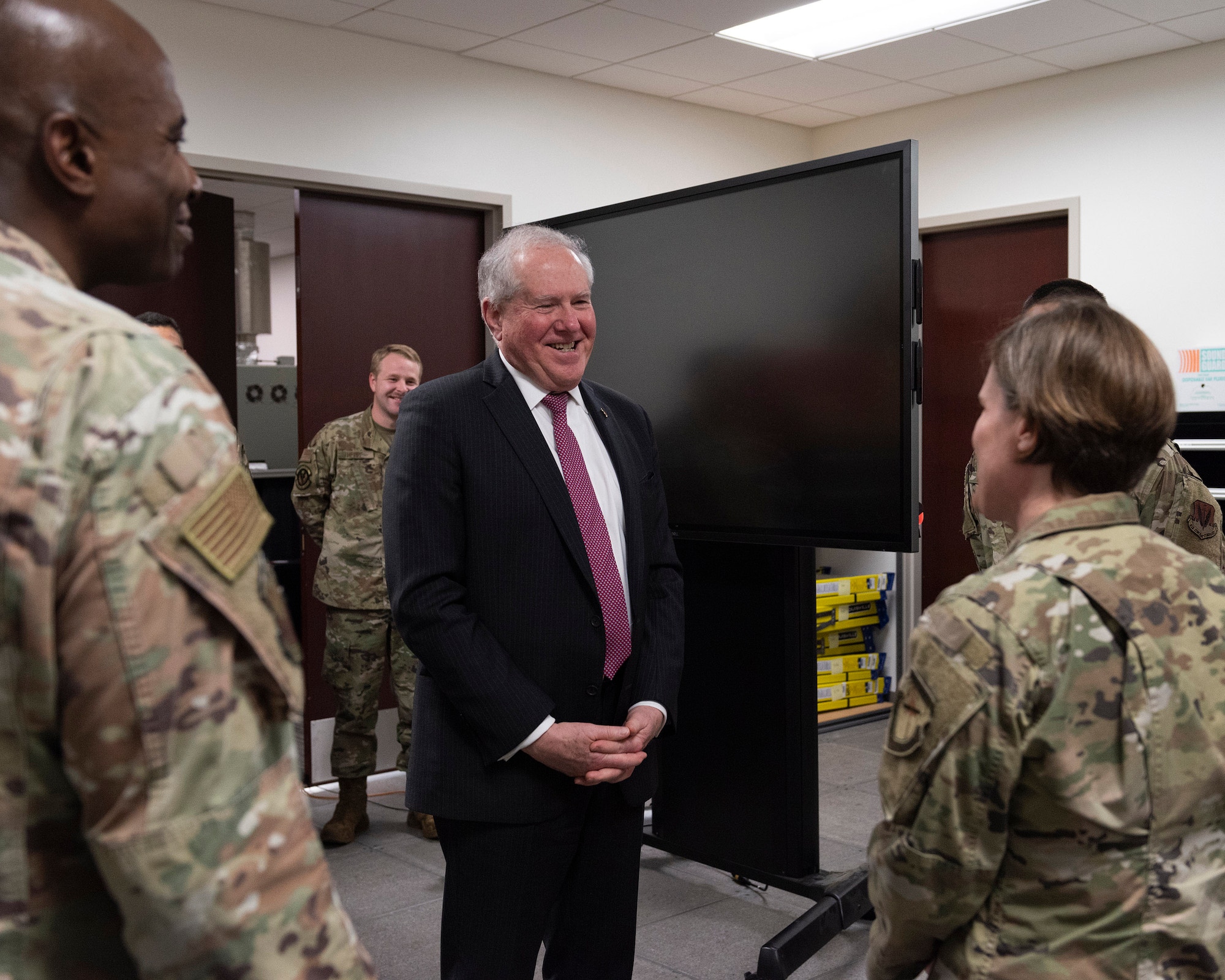 Secretary of the Air Force Frank Kendall (center) smiles as Lt. Col. Sarah Summers, commander of the 709th Technical Maintenance Squadron, Patrick Space Force Base, Fla., shares a humorous mission anecdote with the service’s top civilian.  Kendall visited the Air Force Technical Applications Center Jan. 18, 2023 to discuss current and future operations with Col. James A. Finlayson (left), commander of the Department of Defense’s sole nuclear treaty monitoring center.  (U.S. Air Force photo by Matthew S. Jurgens)