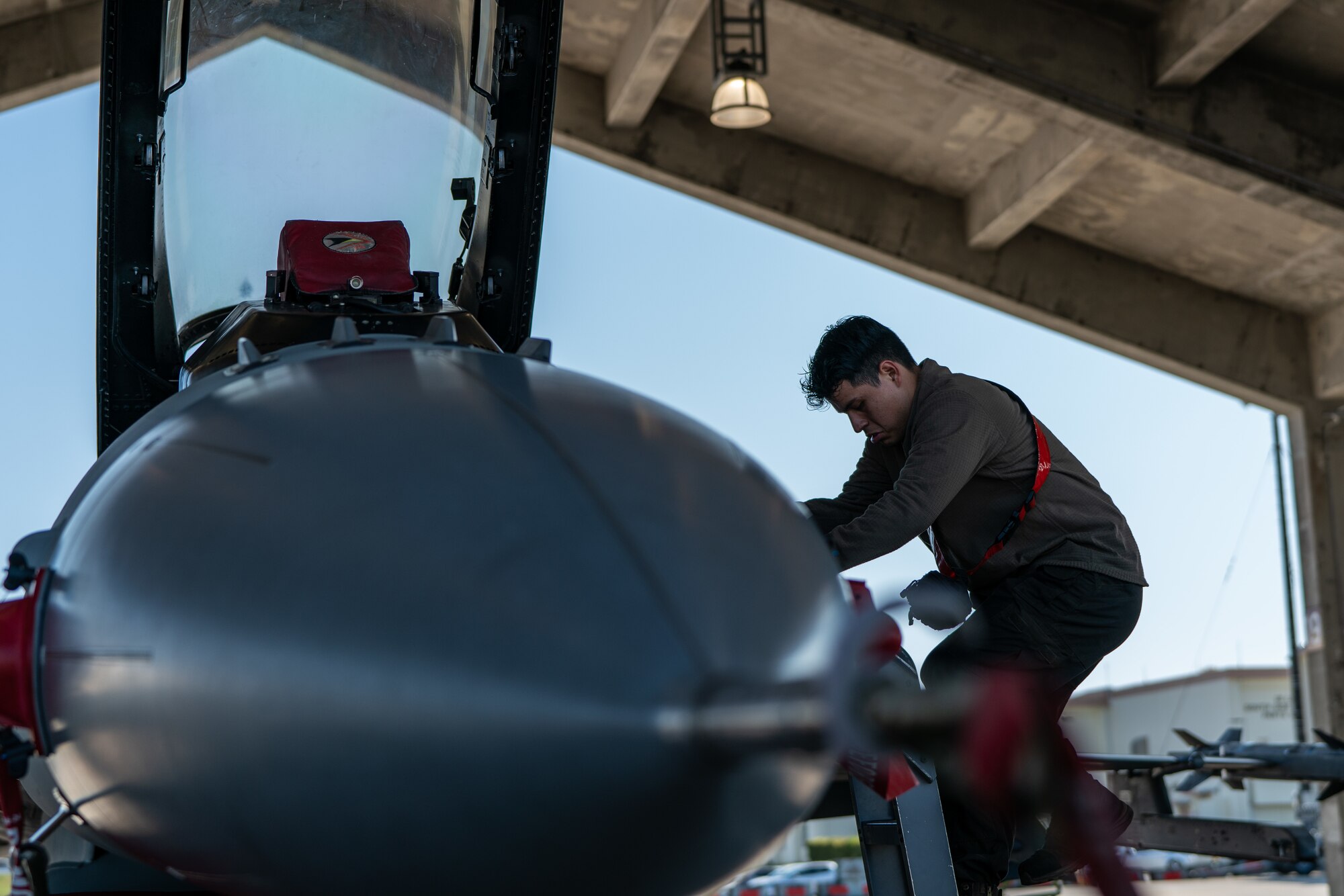 An Airman inspects a jet.
