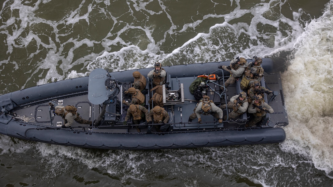 U.S. Marines with the 26th Marine Expeditionary Unit’s Maritime Special Purpose Force (MSPF) and Battalion Landing Team (BLT) 1/6 prepare to board a ship during a Visit, Board, Search, and Seizure (VBSS) course at Fort Eustis, Virginia, Jan. 12, 2023. Marines with the MSPF and BLT 1/6 conducted boat assault force operations to further advance their qualifications to conduct VBSS operations during their upcoming deployment with the 26th MEU. The VBSS course is designed by Expeditionary Operations Training Group to train MSPF, BLT 1/6, and supporting enablers across the Marine Air Ground Task Force to conduct Maritime Interception Operations in preparation for the Amphibious Ready Group/Marine Expeditionary Unit (ARG/MEU) deployment. (U.S. Marine Corps photo by Cpl. Matthew Romonoyske-Bean)