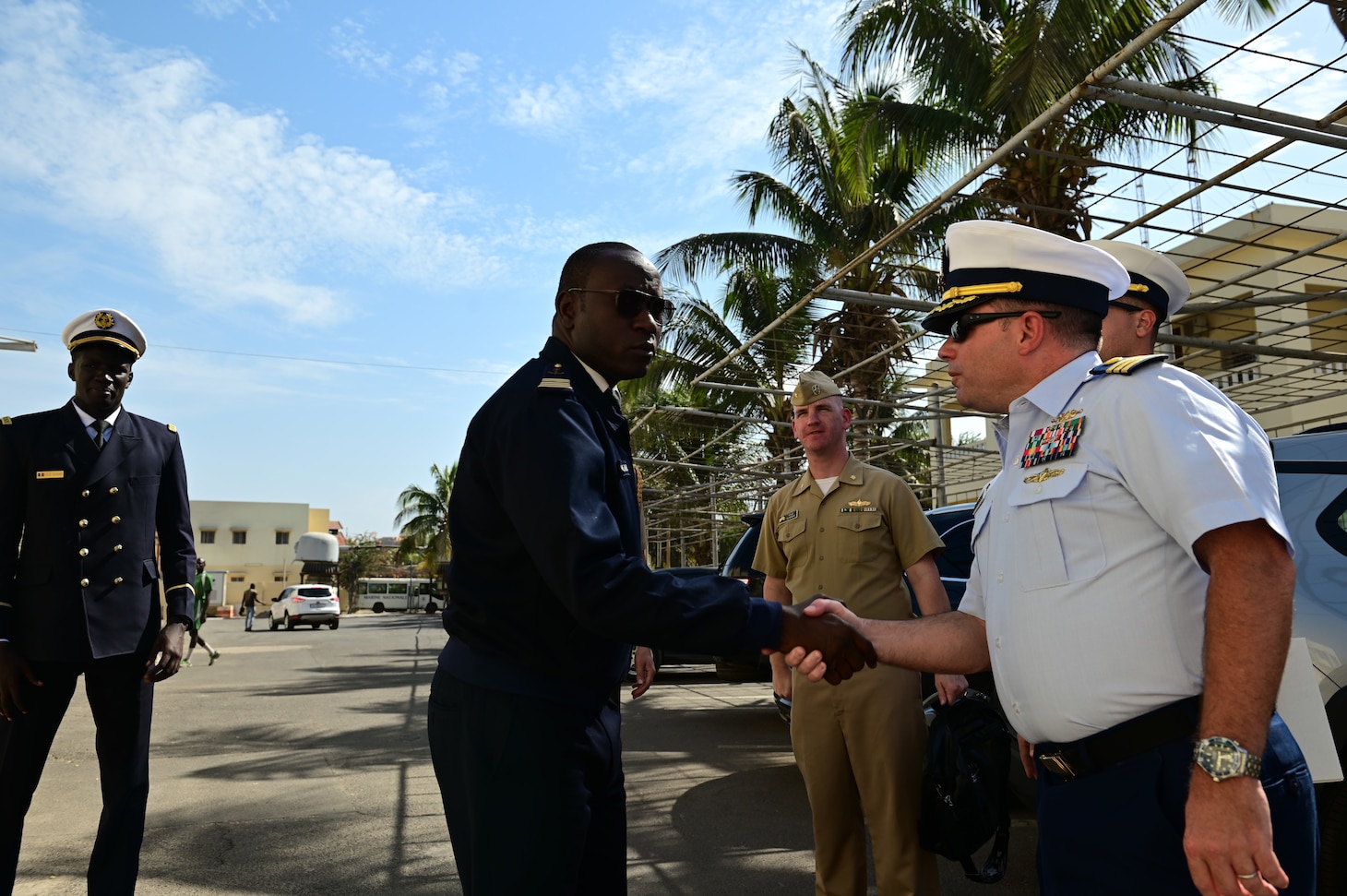 U.S. Coast Guard Cmdr. Corey Kerns, commanding officer of USCGC Spencer (WMEC 905), greets Capt. Karim Mara, Senegalese Navy deputy chief of staff, in Dakar, Senegal, Jan. 17, 2023. Spencer is on a scheduled deployment in the U.S. Naval Forces Africa area of responsibility, employed by the U.S. Sixth Fleet, to carry out joint training, exercises, and maritime security operations alongside AFRICOM partners in support of U.S. interests abroad, regional partnerships, and to strengthen international maritime governance. (U.S. Coast Guard photo by Petty Officer 3rd Class Mikaela McGee)