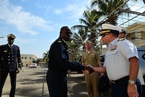 U.S. Coast Guard Cmdr. Corey Kerns, commanding officer of USCGC Spencer (WMEC 905), greets Capt. Karim Mara, Senegalese Navy deputy chief of staff, in Dakar, Senegal, Jan. 17, 2023. Spencer is on a scheduled deployment in the U.S. Naval Forces Africa area of responsibility, employed by the U.S. Sixth Fleet, to carry out joint training, exercises, and maritime security operations alongside AFRICOM partners in support of U.S. interests abroad, regional partnerships, and to strengthen international maritime governance. (U.S. Coast Guard photo by Petty Officer 3rd Class Mikaela McGee)