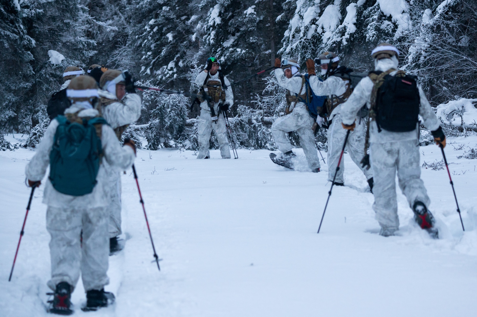 Airmen conduct a simulated combat training in extreme-cold conditions