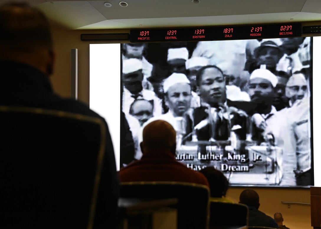 Attendees of the Remembering Dr. Martin Luther King Jr. Event watch Dr. Martin Luther King Jr.’s “I Have a Dream” speech at Joint Base Andrews, Md., Jan. 18, 2023. The famous speech outlined the history of racial injustice in the United States and encouraged everyone to hold the country accountable to its promises of justice, freedom, and equality. (U.S. Air Force photo by Airman 1st Class Austin Pate)