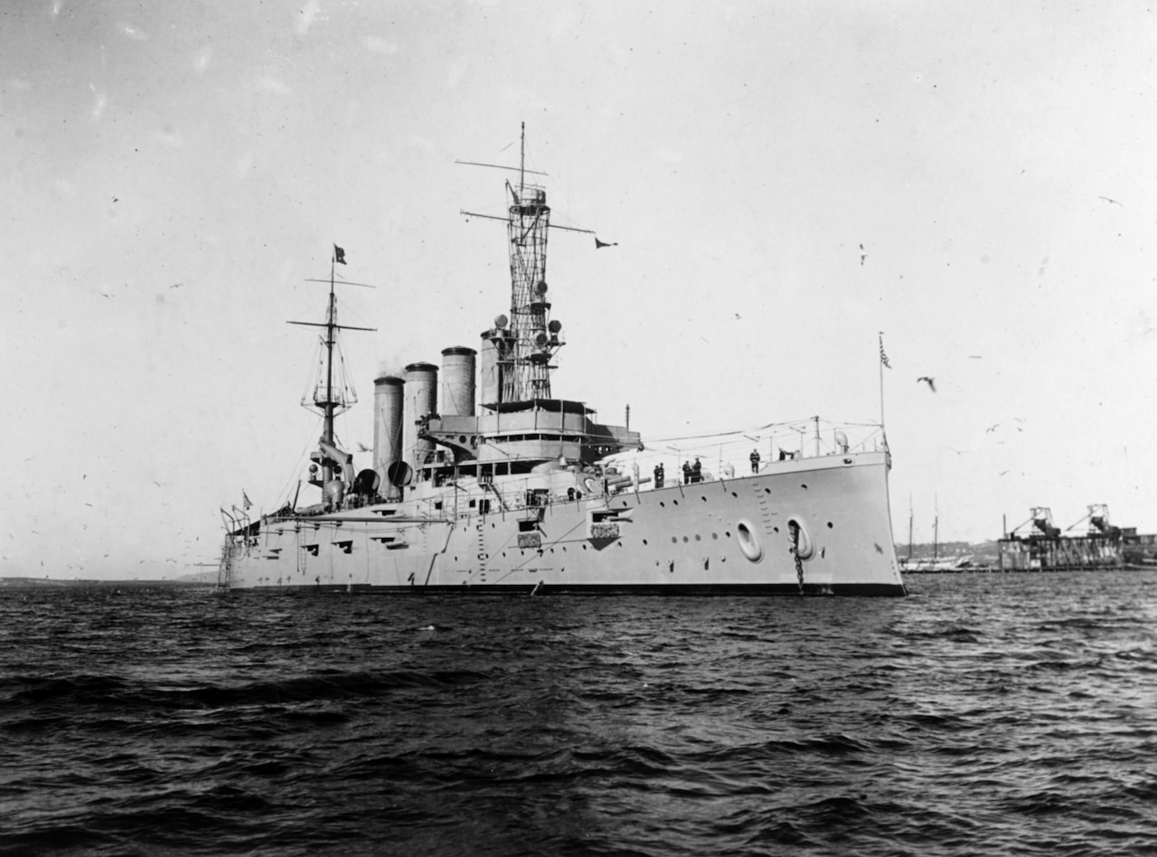A large steam ship floats on the ocean.