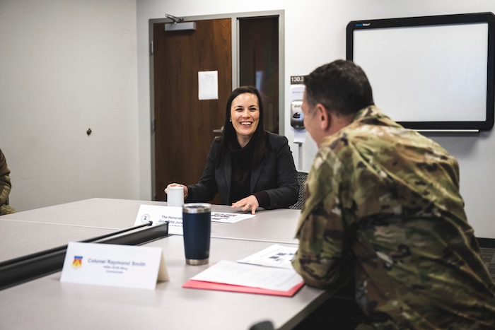 Gina Ortiz Jones, undersecretary of the Air Force, receives a briefing Jan. 9 from Col. Ray Smith, 445th Airlift Wing commander, during her tour of Wright-Patterson Air Force Base, Ohio. It marked one of eight stops during her visit.