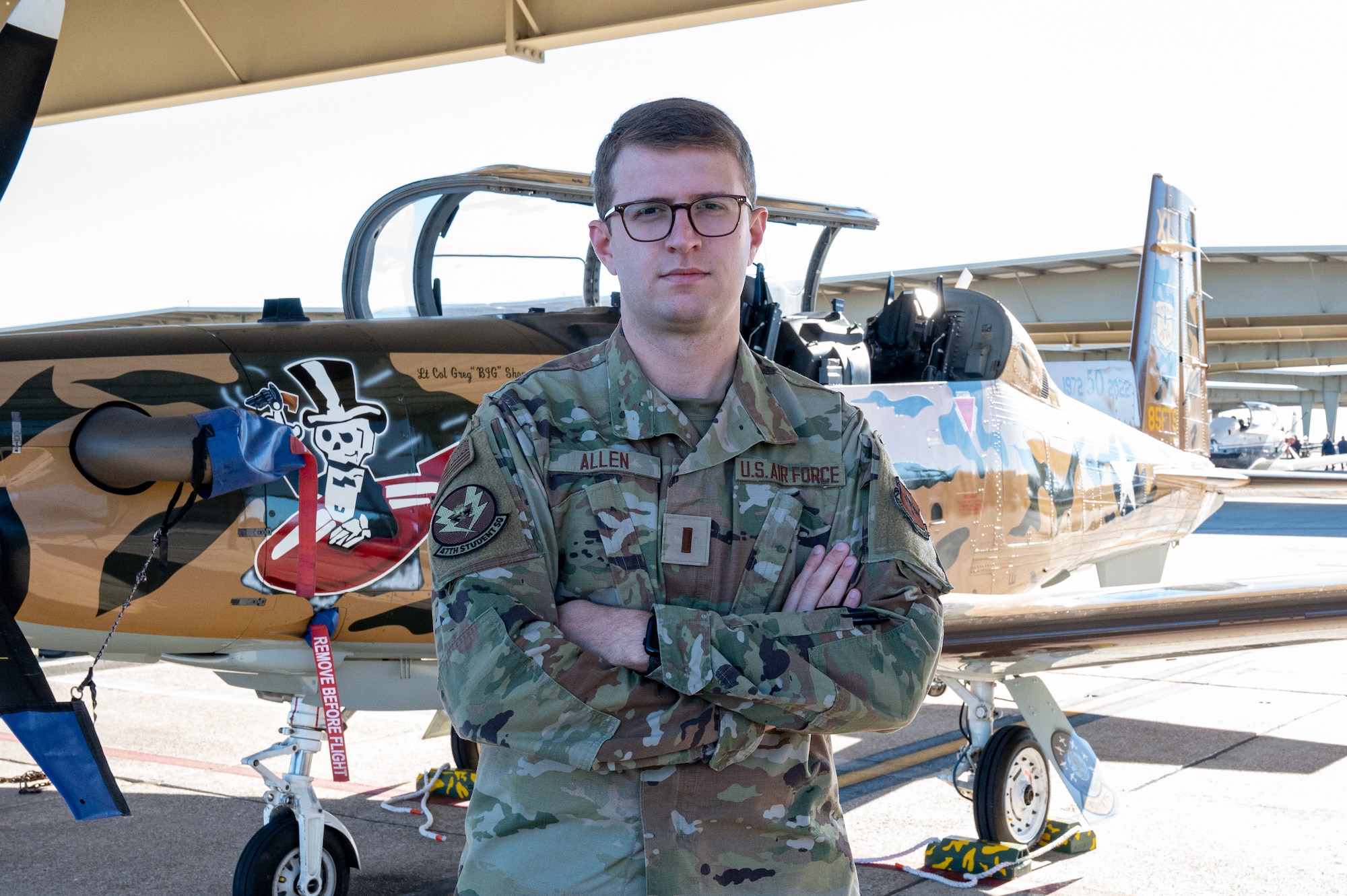 U.S. Air Force 2nd Lt. Garret Allen poses in front of a T-6A Texan II Laughlin Air Force Base, Texas, on Jan. 5, 2023. The T-6 is the first aircraft pilots get to fly during their year-long training. (U.S. Air Force photo by Senior Airman David Phaff)