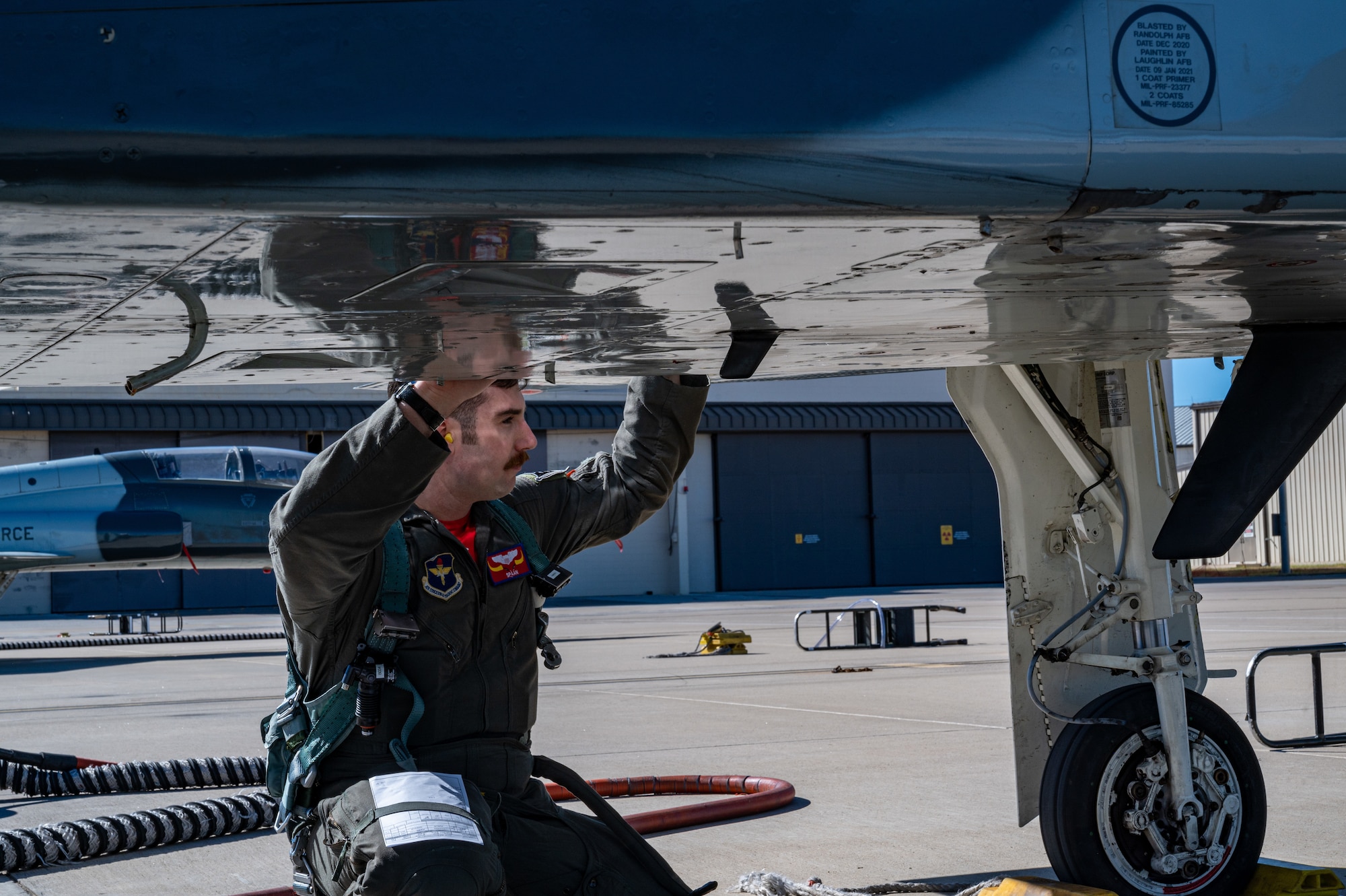 U.S. Air Force Capt. Garrett Green, 87th Flying Training Squadron, instructor pilot, performs his pre-flight inspections before a standard cross country with students to hone their skills on Jan. 13, 2023, at Laughlin Air Force Base, Texas. Cross country missions have students fly to different locations over the course of several days, to gain a large amount of flying time and test what they have learned. (U.S. Air Force photo by Senior Airman David Phaff)