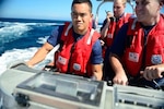 A small boat crew from the Coast Guard Cutter Stratton conducts a safety patrol near the cutter while underway in the Pacific Ocean, Aug. 14, 2012. Boatswain's mates (BM) are capable of performing almost any task in connection with deck maintenance, small boat operations, navigation, and supervising all personnel assigned to a ship's deck force or shore unit, and are in charge of the newest Coast Guard small boats while conducting search and rescue, aids to navigation, law enforcement and security operations. (U.S. Coast Guard photo by Petty Officer 2nd Class Annie R. B. Elis)