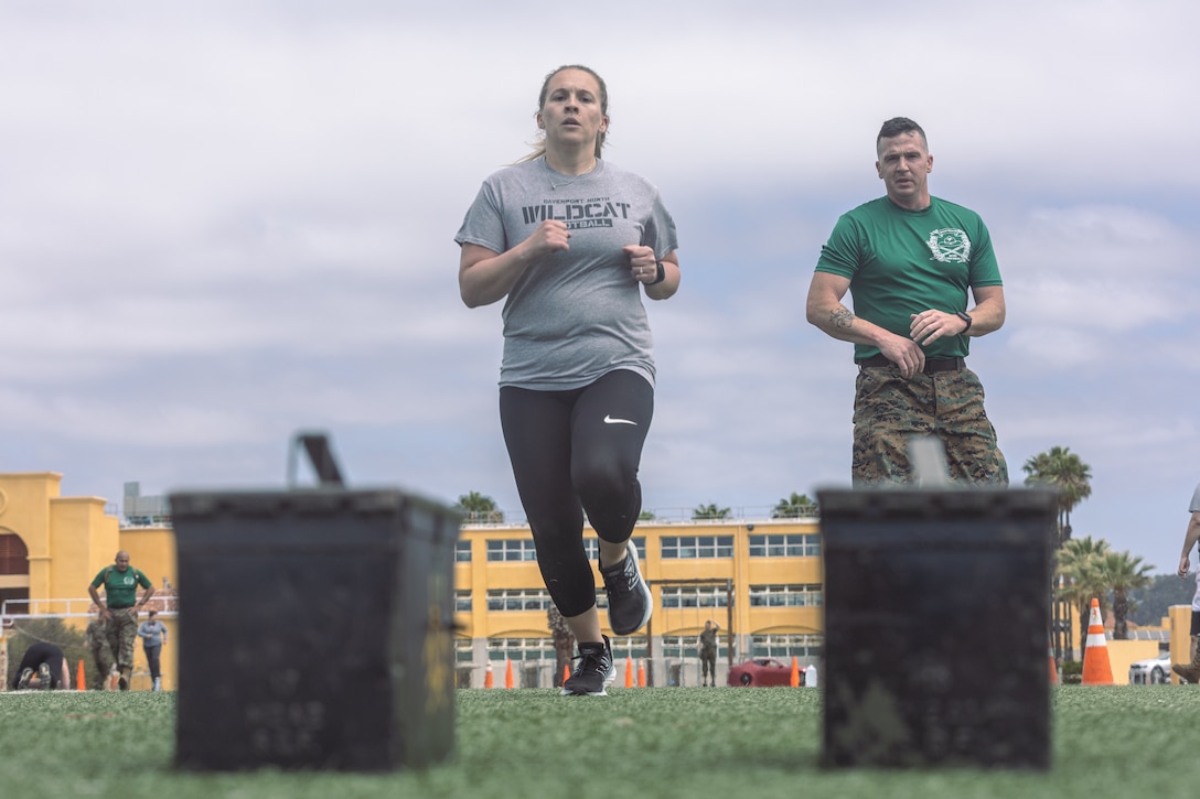 An educator from the 9th Marine Corps District conducts the Combat Fitness Test during an Educators’ Workshop at Marine Corps Recruit Depot San Diego, May 17, 2022. The 9th Marine Corps District is home to Recruiting Stations, Twin Cities, Milwaukee, Des Moines, Kansas City, Oklahoma City, Chicago, St. Louis, Indianapolis. Educators were welcomed to the depot to receive a first-hand experience on what recruit training is like. (U.S. Marine Corps photo by Cpl. Tyler W. Abbott)