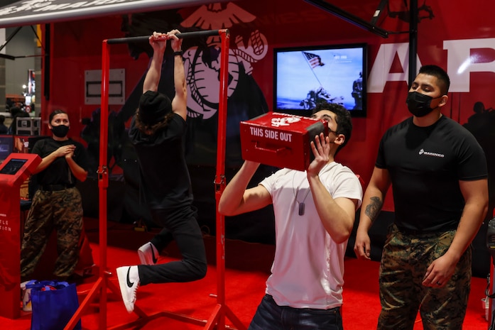 U.S. Marines with Recruiting Station Chicago, 9th Marine Corps District, attend the Chicago Auto Show at McCormick Place, Chicago, Feb. 16, 2022. The recruiters used the event to introduce the new Battle Position virtual reality challenge. (U.S. Marine Corps photo by Lance Cpl. Tyler M. Solak)