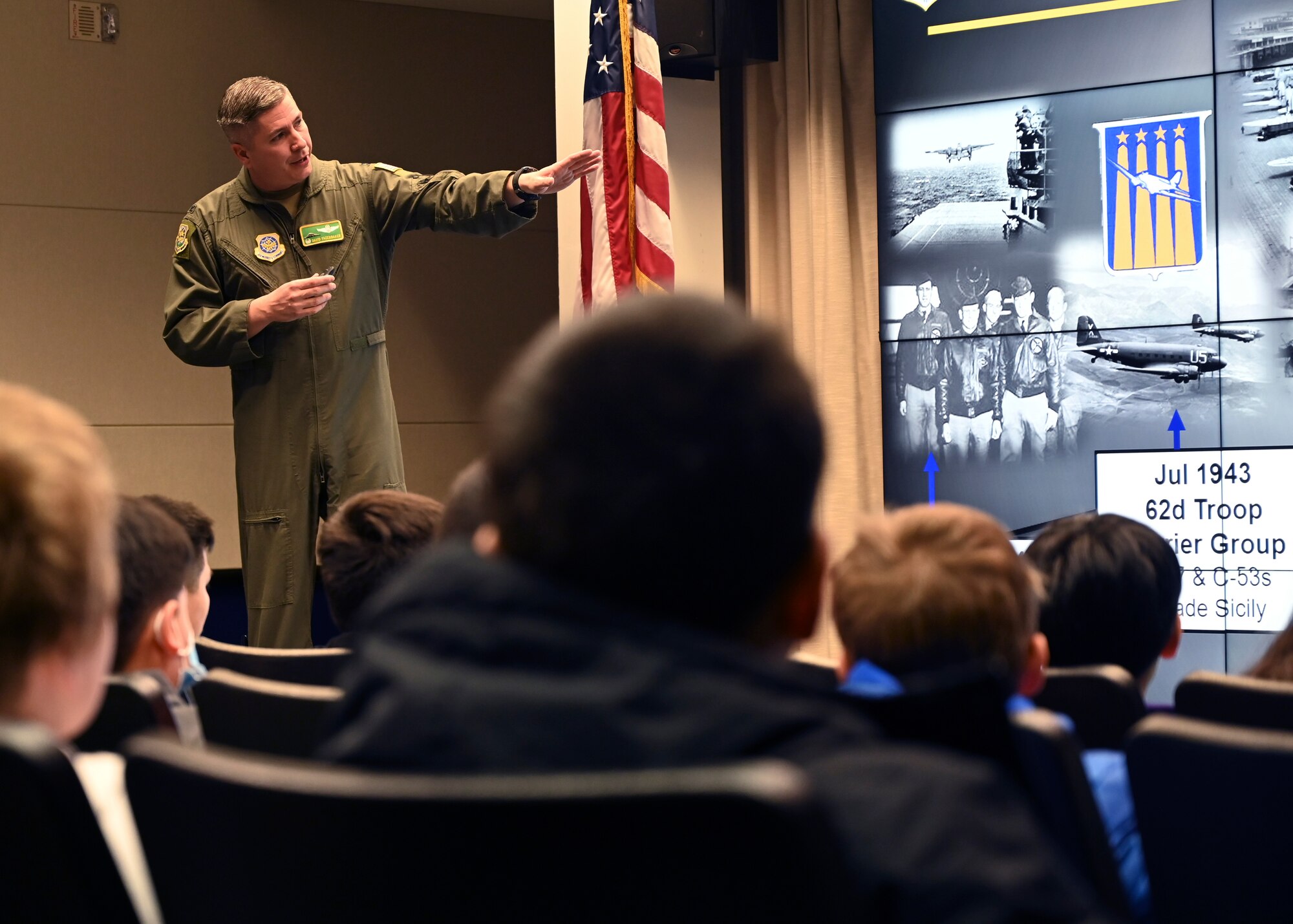 U.S. Air Force Col. David Fazenbaker, 62d Airlift Wing commander, welcomes students from Stafford Elementary School, Tacoma, during an Aviation Inspiration and Mentorship (AIM) tour at Joint Base Lewis-McChord, Washington, Jan. 17, 2023. AIM is a community outreach program that is designed to inform, influence and inspire the next generation of Air Force aviators. (U.S. Air Force photo by Senior Airman Callie Norton)