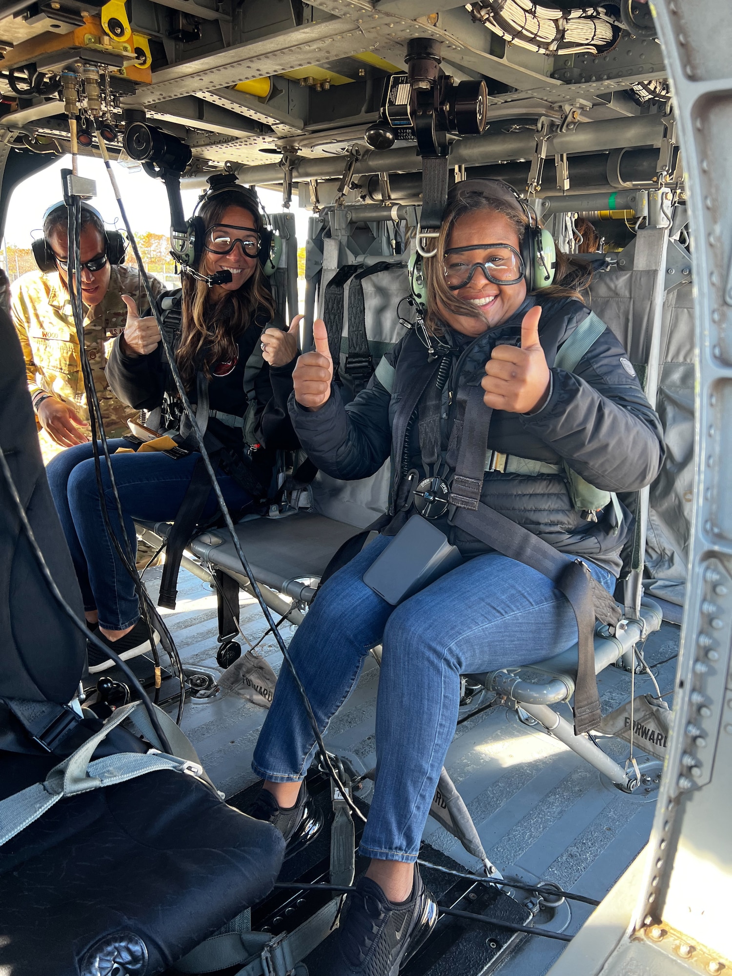 Guidance counselors  from local high schools ready to take flight in an HH-60G Pave Hawk helicopter.
