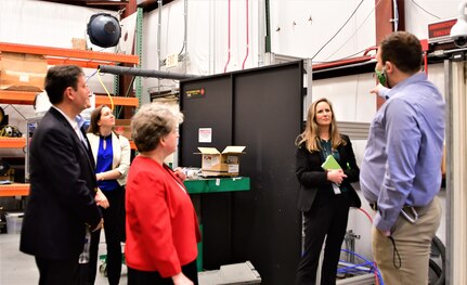 IMAGE: Officials from the National Science Foundation (NSF) made a stop at the Naval Surface Warfare Center Dahlgren Division’s (NSWCDD) High Energy Laser (HEL) lab during their tour of NSWCDD facilities Jan. 5. Pictured from left to right are Dr. Jesus Soriano-Molla, NSF Program Director, Jennifer Lunday, Laser Weapons System Optics and Beam Control branch head, Dr. Carol Bessel, NSF Translation Impacts (TI) Division section head, NSWCDD Chief Technology Officer Jennifer Clift, SSTM, and NSWCDD’s HEL subject matter expert Chris von Hohenleiten, who provided the NSF visitors with an overview of the HEL Weapons System capabilities and operations.