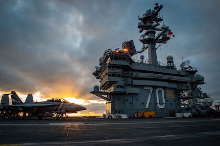 An F/A-18F Super Hornet, assigned to the “Bounty Hunters” of Strike Fighter Squadron (VFA) 2, is chocked and chained on the flight deck of Nimitz-class aircraft carrier USS Carl Vinson (CVN 70) Dec. 14, 2022. (U.S. Navy photo by Mass Communication Specialist 3rd Class Isaiah Goessl)
