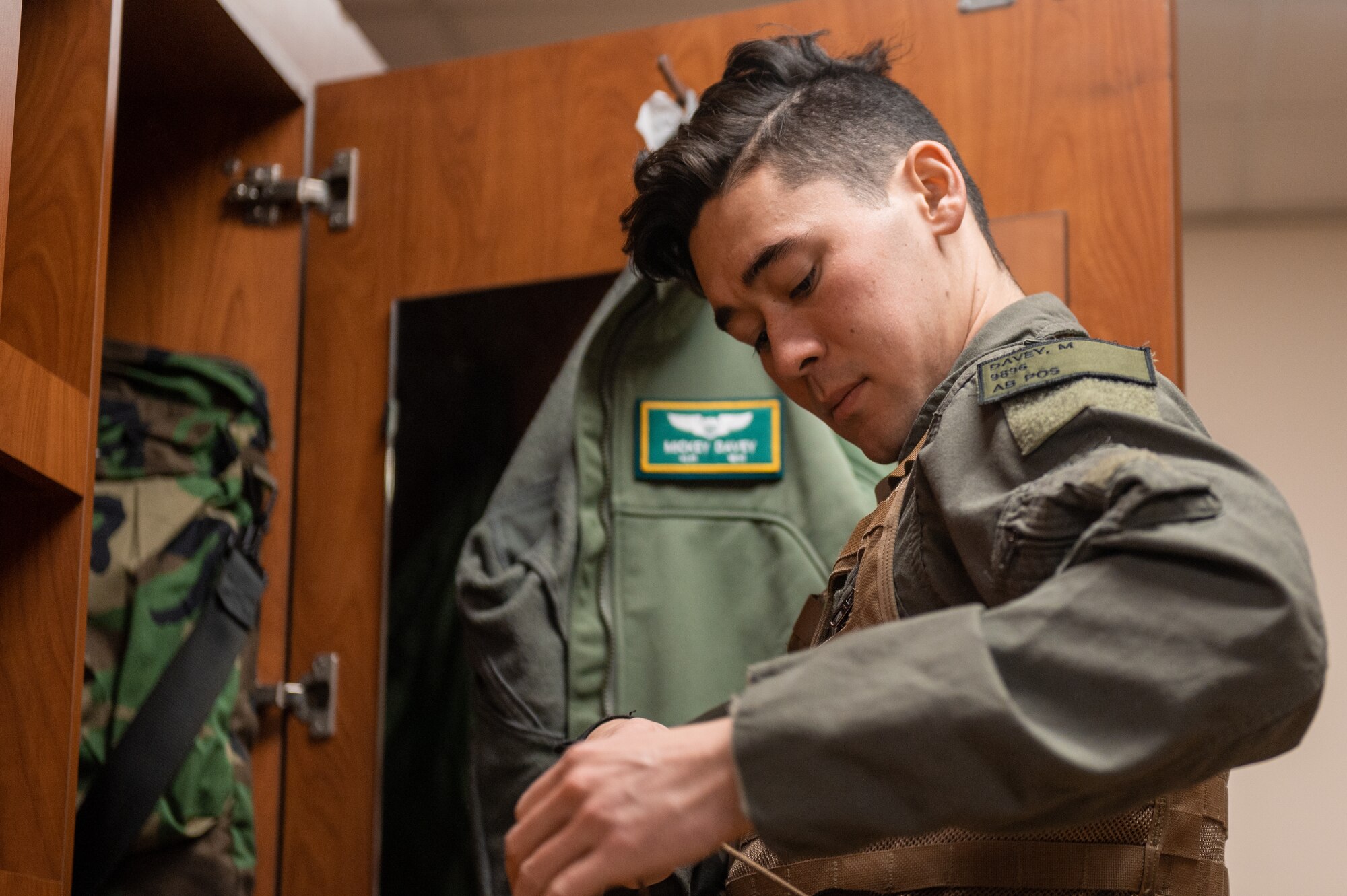 U.S. Air Force 1st Lt. Michael Davey, 25th Fighter Squadron A-10C Thunderbolt II pilot, dons flight equipment before participating in a next generation aircrew protection (NGAP) evaluation at Osan Air Base, Republic of Korea, Jan. 18, 2023.