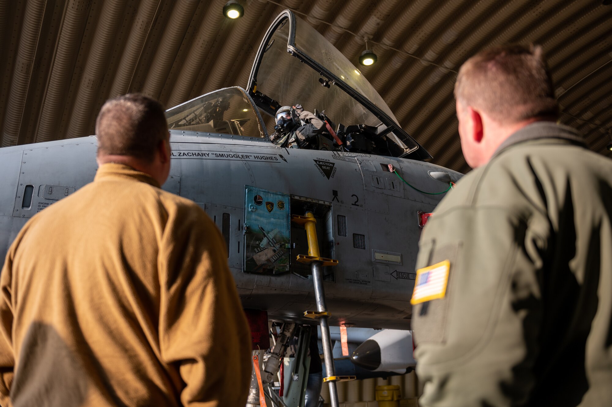 U.S. Air Force Chief Master Sgt. Charles Hall, Pacific Air Forces aircrew flight equipment major command functional manager, and U.S. Air Force Col. Daniel Roberts, 97th Medical Group commander at Altus Air Force Base, Oklahoma, observe U.S. Air Force 1st Lt. Michael Davey, 25th Fighter Squadron A-10C Thunderbolt II pilot, during a next generation aircrew protection (NGAP) evaluation at Osan Air Base, Republic of Korea, Jan. 18, 2023.