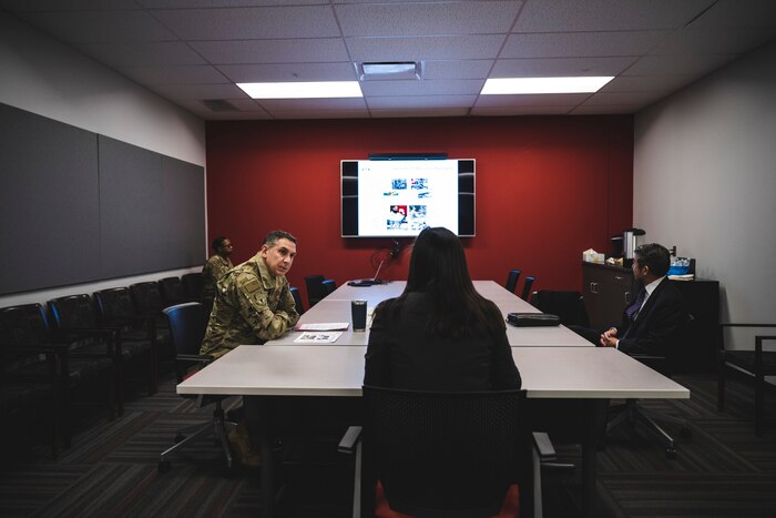 Undersecretary of the Air Force Gina Ortiz Jones receives a briefing Jan. 9 from Col. Ray Smith, 445th Airlift Wing commander, during her tour of Wright-Patterson Air Force Base, Ohio.